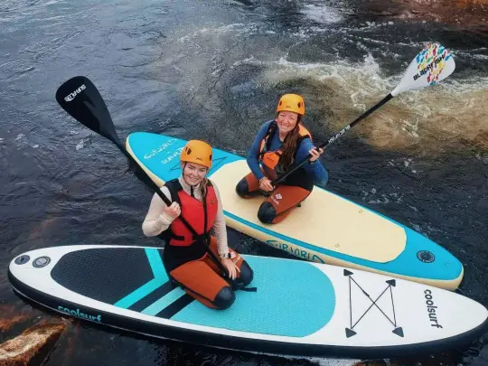 people on stand up paddling boards in sirdal
